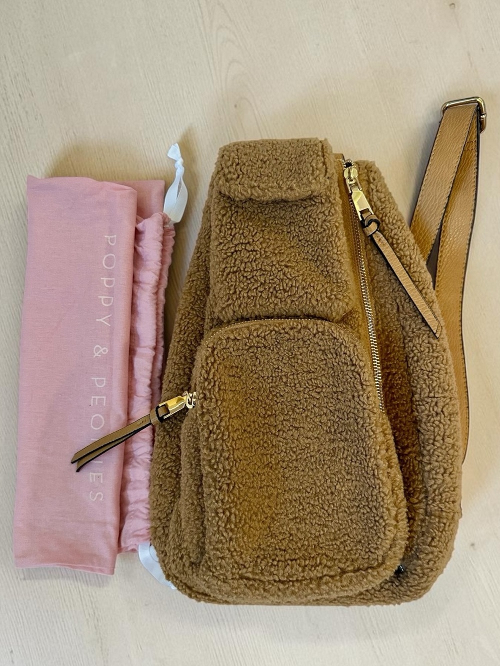 Poppy & Peonies sherpa sling bag in camel with blush lining